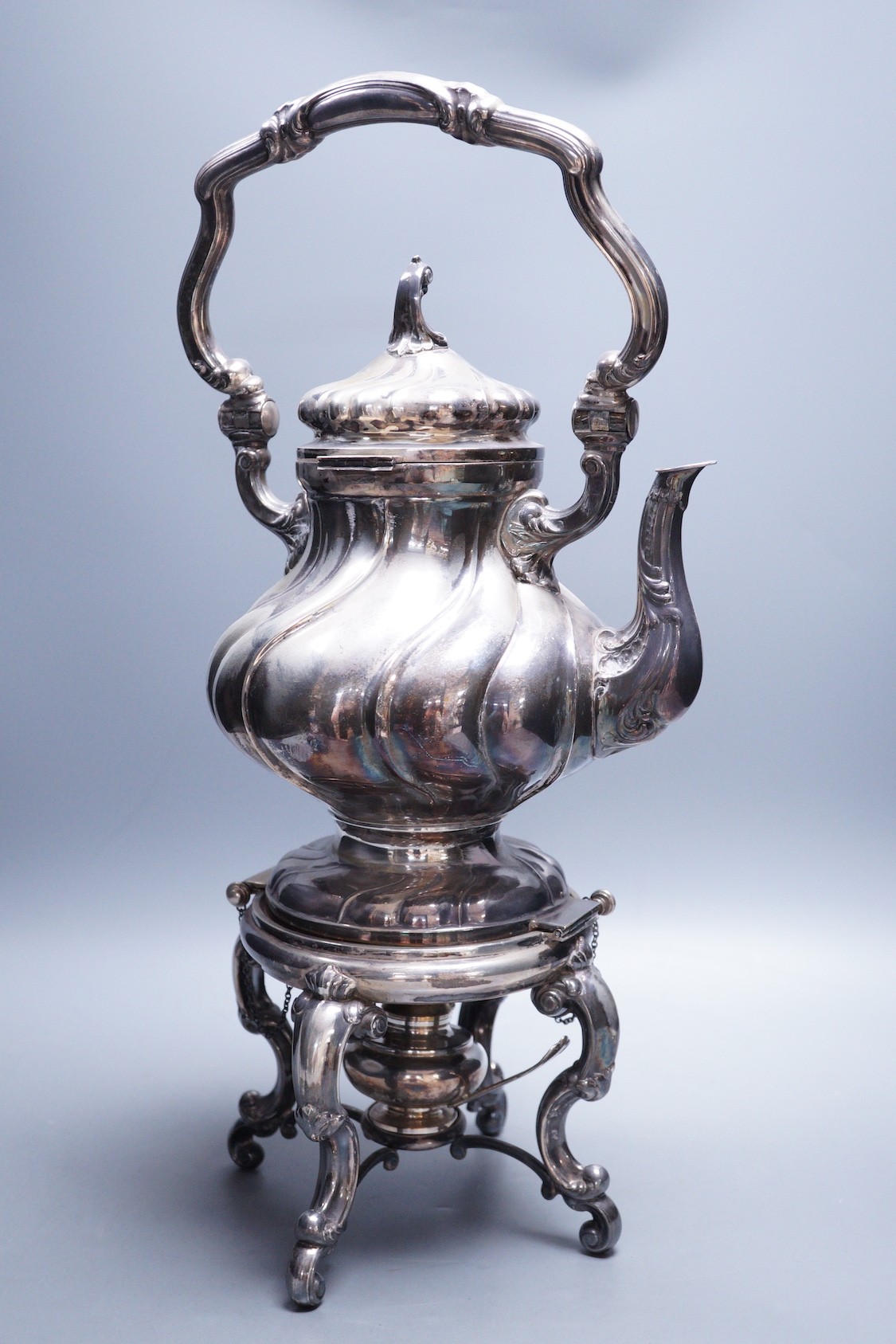 A late 19th century Italian 800 standard white metal tea kettle on stand with burner, of spiral pear form, makers mark AL 1, overall height 48.5cm